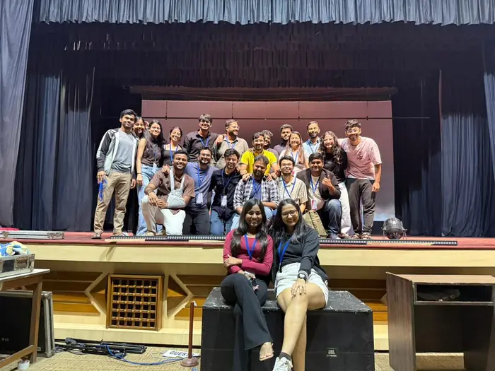 Festival team members posing together on stage
